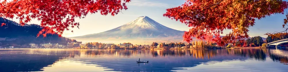 Colorful Autumn Season and Mountain Fuji with morning fog and red leaves at lake Kawaguchiko